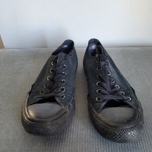 Black low-top Converse sneakers